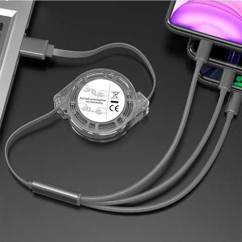Das HandyOase 3-in-1 Ausziehbares USB-Kabel – Lade- & Daten-Synchronisations-Kabel ist auf einer dunklen Oberfläche mit einem Laptop und Smartphone verbunden.